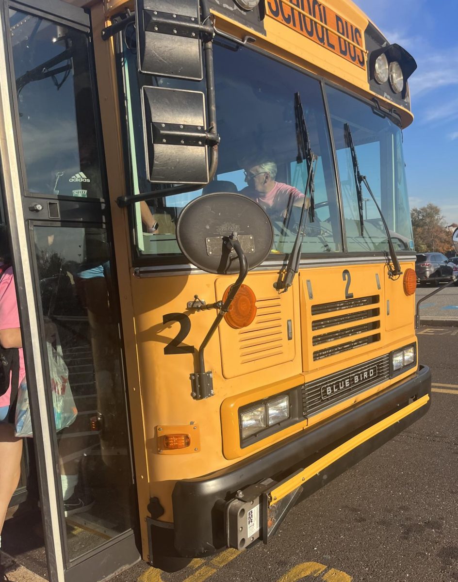 Mr. George welcomed the girls soccer team before driving them to their game.
