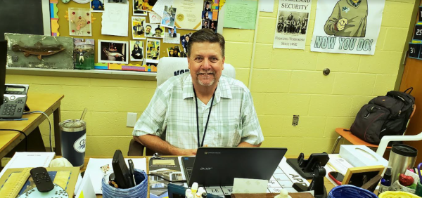 Mr. Brumbaugh reflects on 31 years of teaching excellence, sitting at the desk where countless lessons were crafted.
