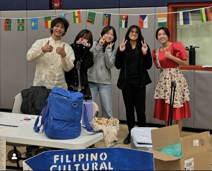 Members of the Filipino cultural club, enthusiastically celebrating the second annual Multicultural Celebration, with Halo Halo as the top menu. 
