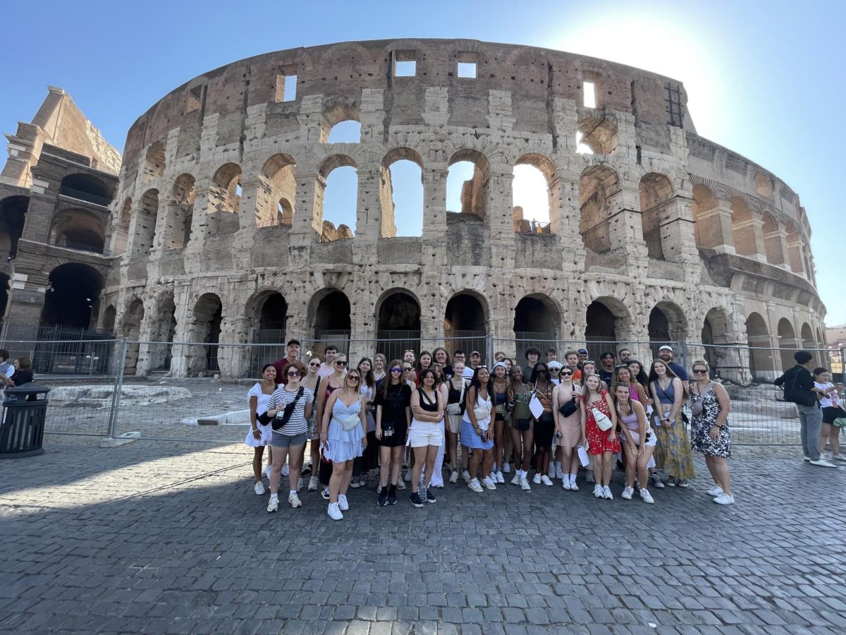 Students on 2024 trip to Italy in front of the Colosseum