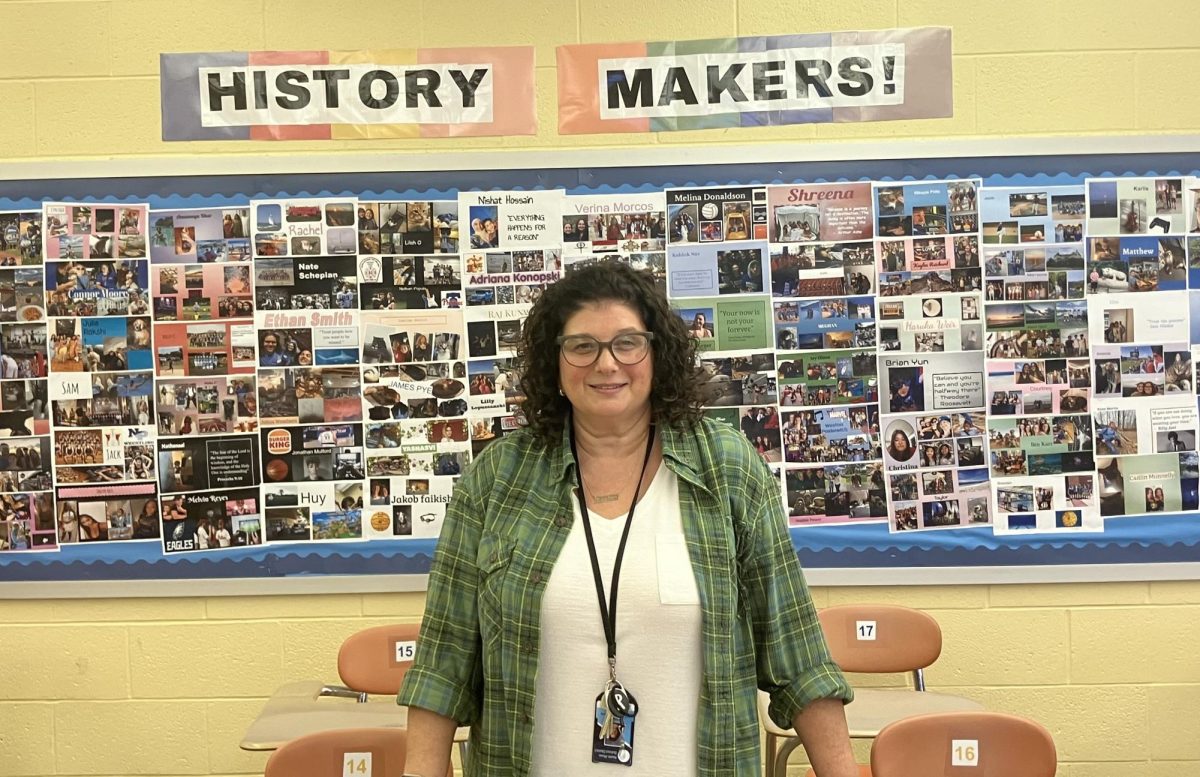 Mrs. Bari-Rae Rudolph in front of her "History Makers" bulletin board at NPHS