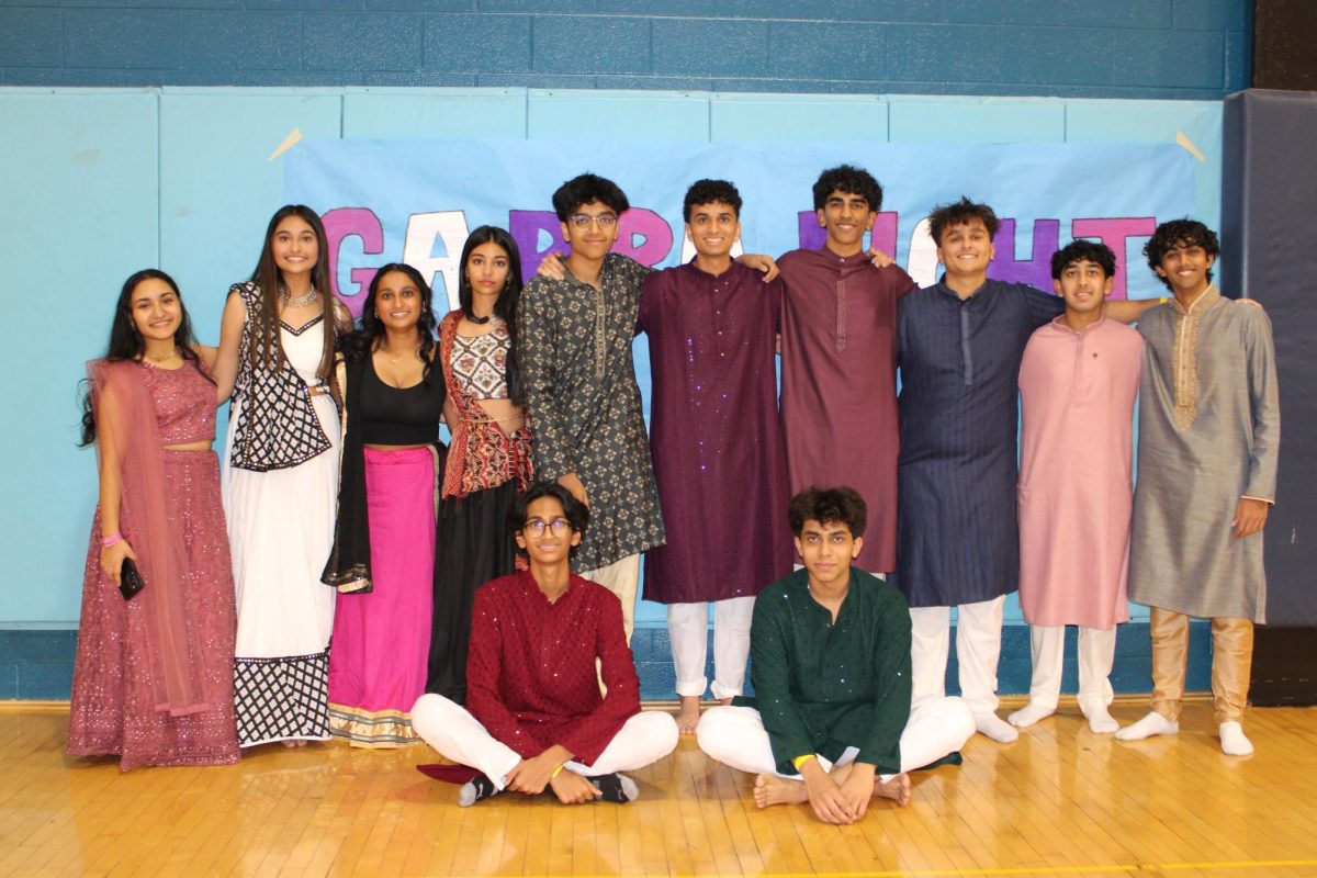 Attendees wearing traditional Garba clothing, excited for the events to come.