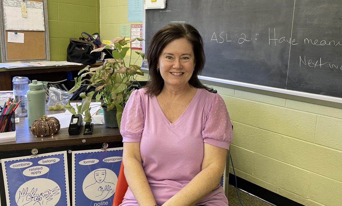 Signing her classes away:  Mrs. SallyAnn Emilius teaches American Sign Language at NPHS, and as a deaf person herself, she has embraced her role in the worlds of both the hearing and the deaf. 