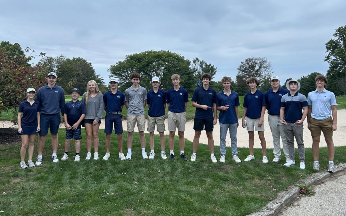 Team Navy celebrates their win with their caddies