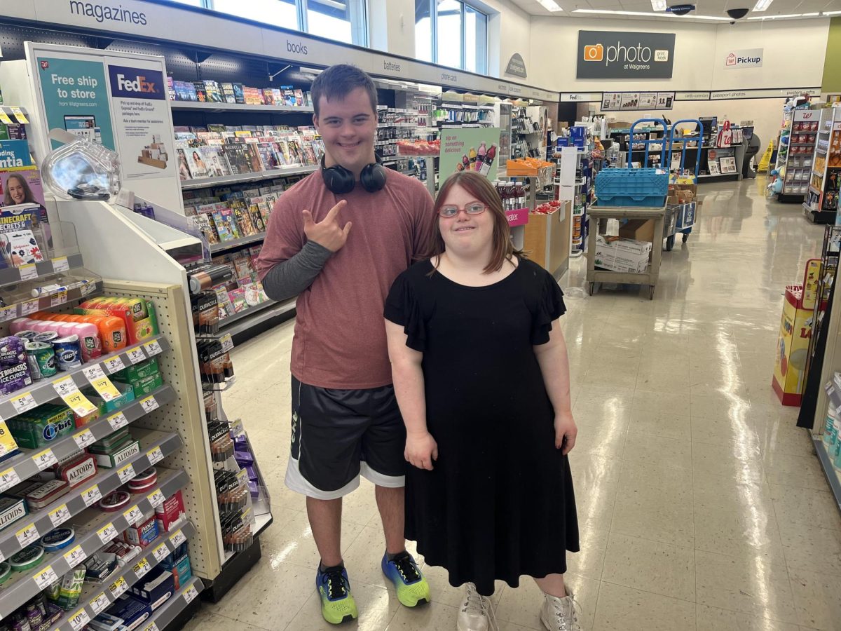 Post-12 members Jimmy Shea and Izzy Maggi working together at Walgreens 