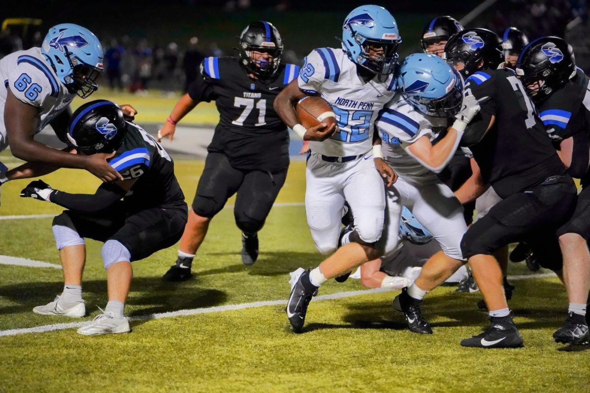 Josiah Coleman follows a block during a regular season meeting between North Penn and CB South