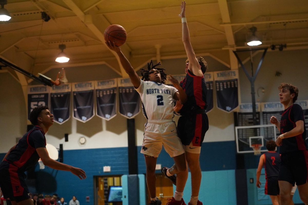 North Penn senior Lee Hammond lays up over a defender.