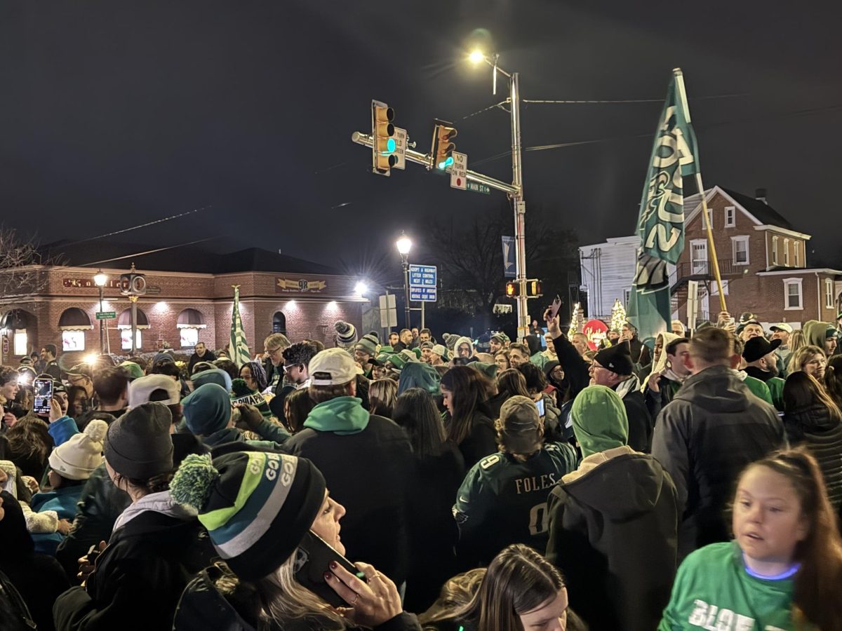 Locals gather at Main and Broad St in Lansdale, PA on February 9, 2025 as they celebrate a dominant 40-22 Eagles Super Bowl victory. 