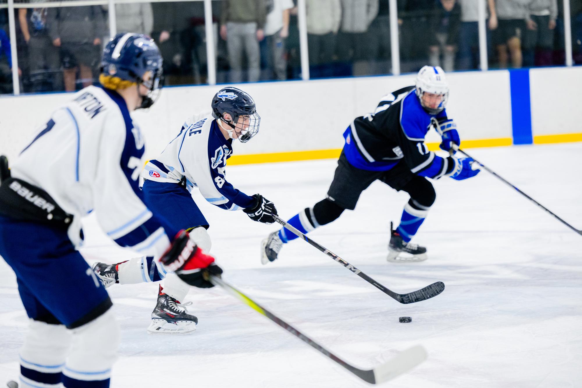 North Penn's James Boyle skates alongside Sam Norton in Wednesday's matchup.